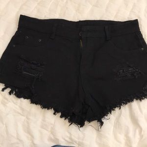 Distressed black jean shorts